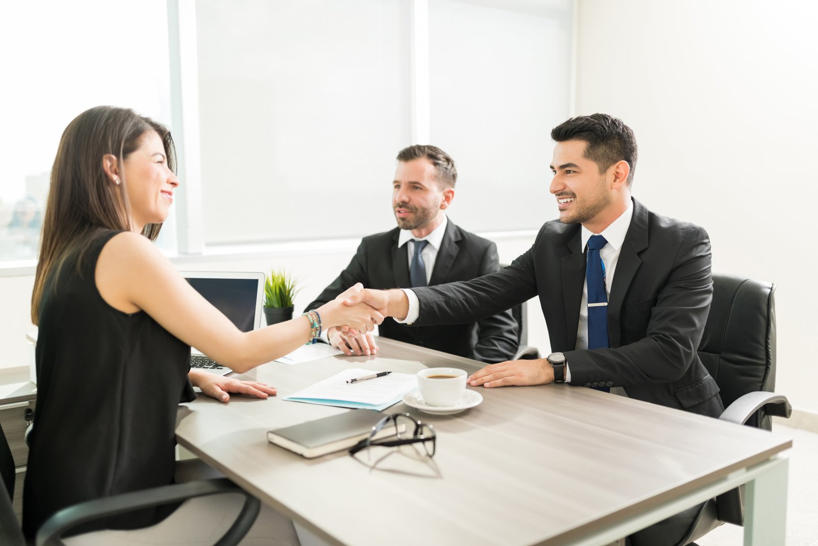 An employer and a candidate shaking hands after an interview